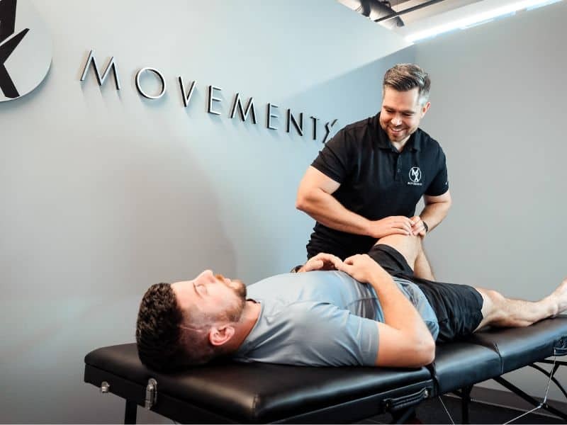 Physical therapist treating a client at Movementx inside FLEX